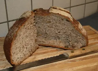 Walnut bread and slices described as sold at Vianden’s nut fair, Luxembourg; national bread illustration with capture location unspecified.
