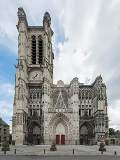 The cathedral’s richly carved west facade and single tall clock tower above the open square.